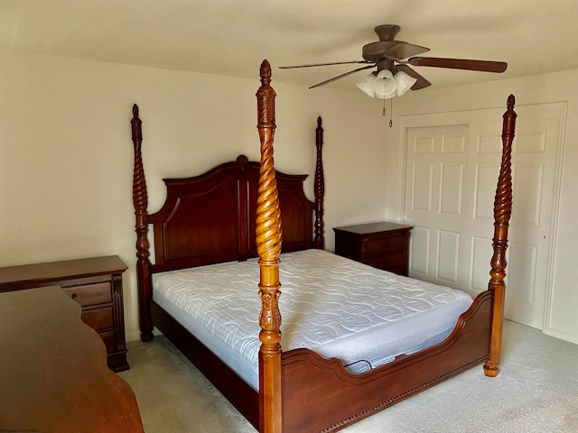 bedroom with ceiling fan and light carpet