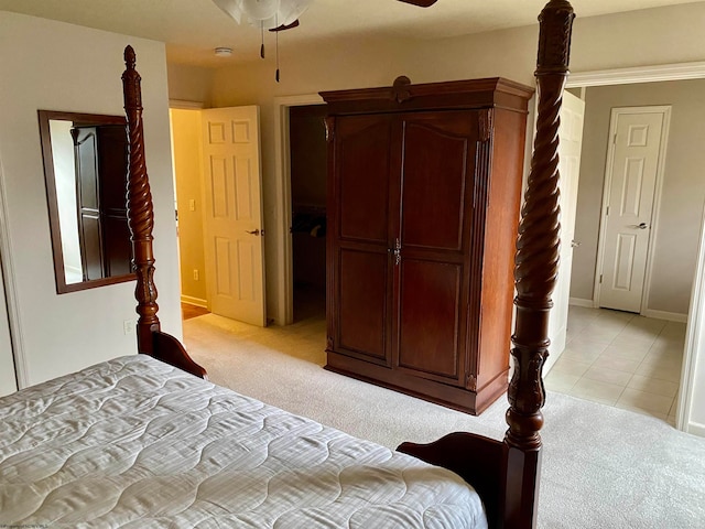 bedroom with light carpet and ceiling fan