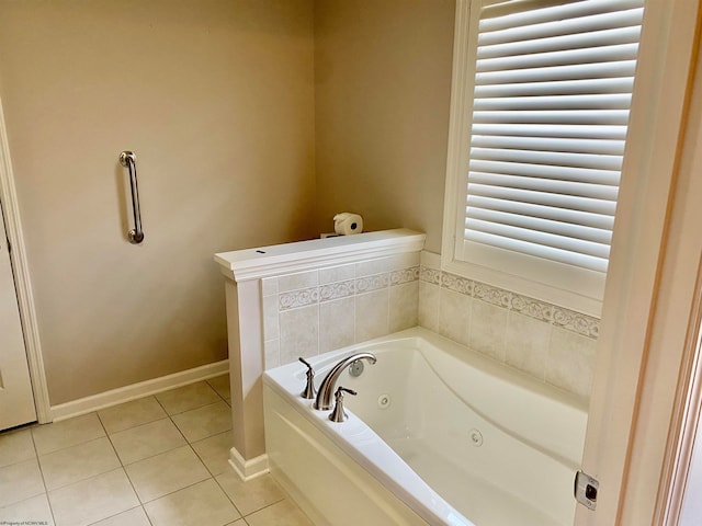 bathroom featuring tile patterned flooring and a tub