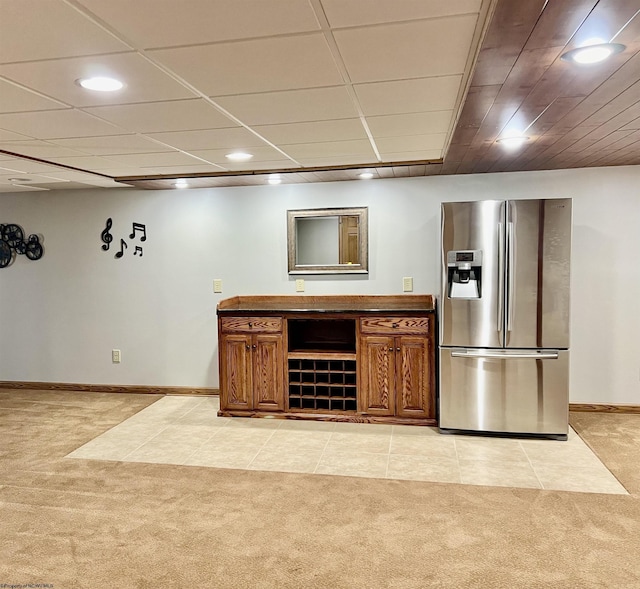 bar featuring stainless steel fridge, recessed lighting, light carpet, and baseboards