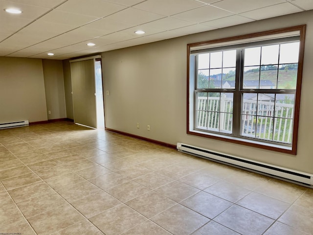 unfurnished room with light tile patterned floors, recessed lighting, baseboard heating, and baseboards