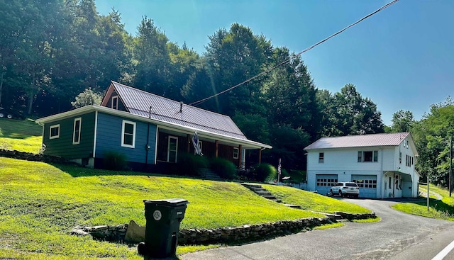 view of front of home featuring a garage and a front lawn