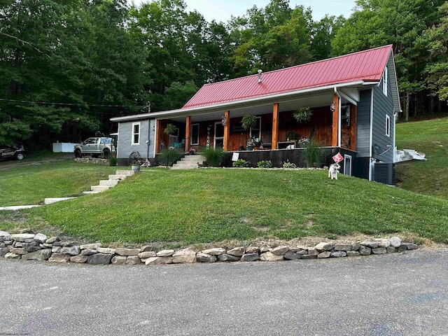 view of front of property featuring central AC unit, a front lawn, and a porch