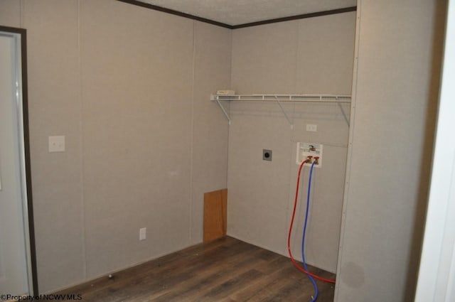 clothes washing area with hookup for a washing machine, dark hardwood / wood-style floors, and electric dryer hookup