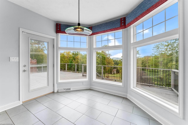 unfurnished sunroom with plenty of natural light