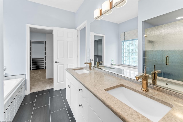 bathroom featuring vanity, separate shower and tub, and tile patterned floors