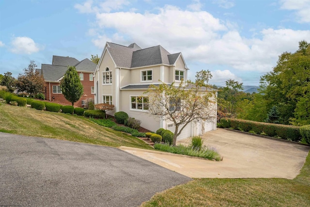 exterior space with a lawn and a garage