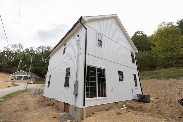 view of side of home featuring central AC