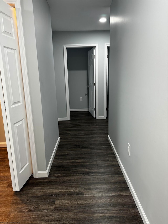 hallway featuring dark hardwood / wood-style floors