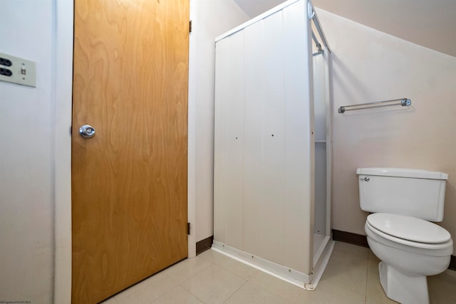 bathroom with tile patterned flooring and toilet