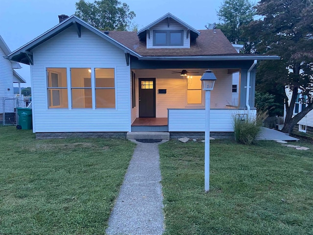 bungalow-style house featuring a front yard and a porch