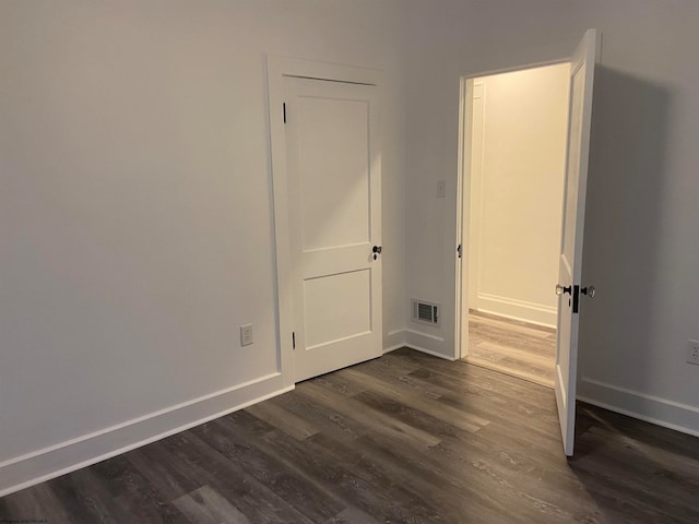 empty room featuring dark hardwood / wood-style floors