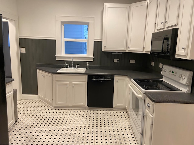 kitchen with black appliances, white cabinetry, and sink