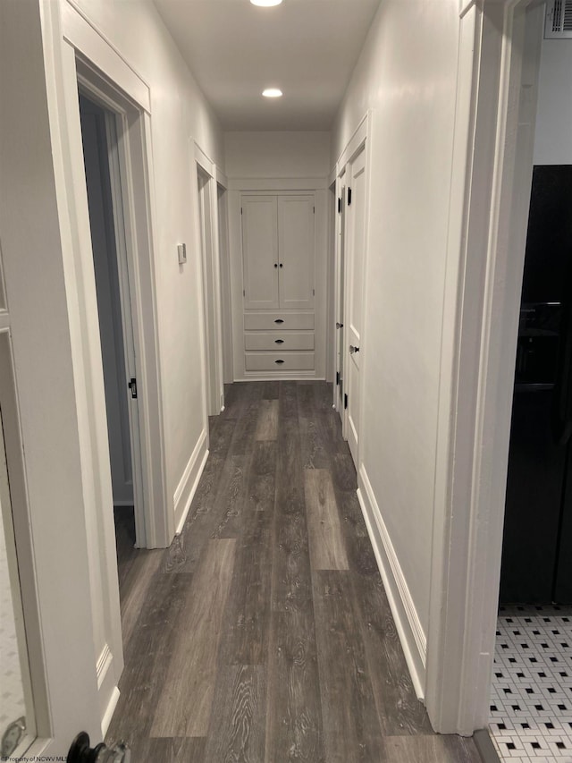 hall with dark hardwood / wood-style floors