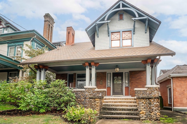 craftsman-style home with covered porch