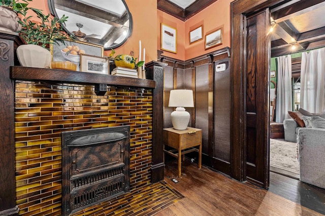 details featuring a fireplace, coffered ceiling, beamed ceiling, and hardwood / wood-style flooring