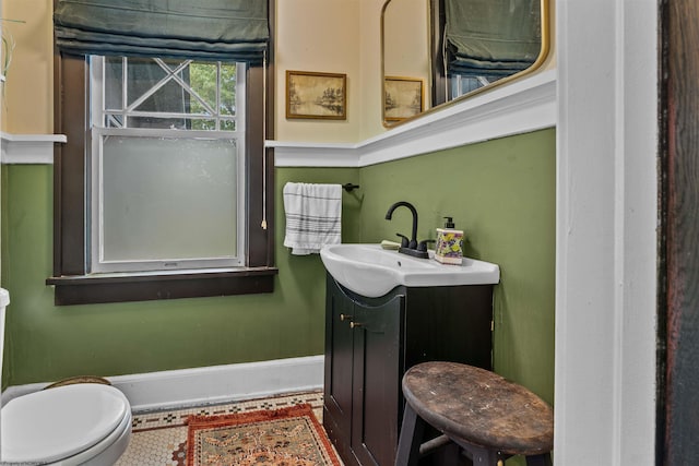 bathroom with vanity and toilet