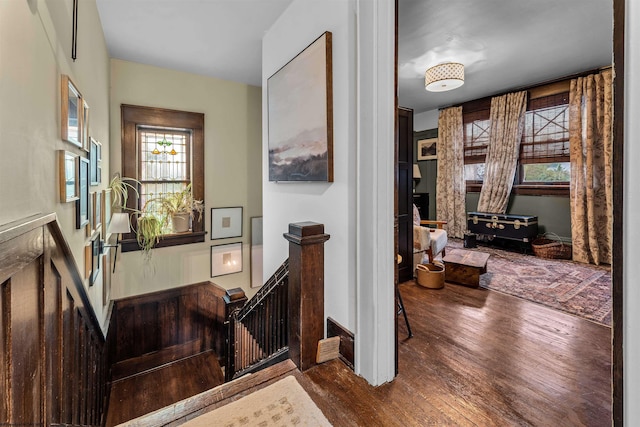 staircase with hardwood / wood-style floors