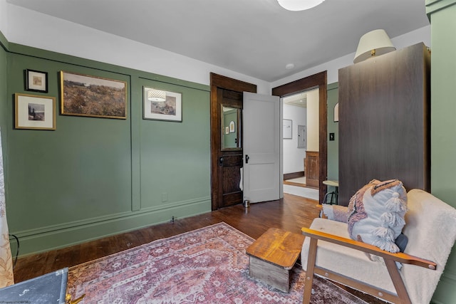 living area with dark hardwood / wood-style flooring