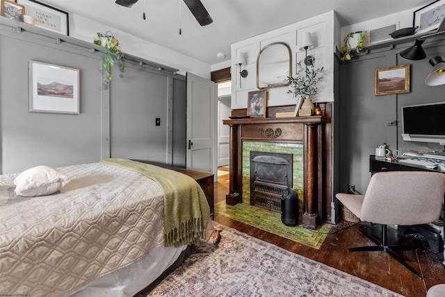 bedroom with ceiling fan and hardwood / wood-style floors