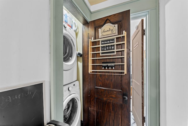 laundry room featuring stacked washer and dryer