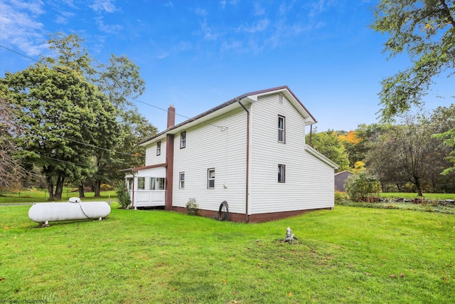 view of property exterior with a yard