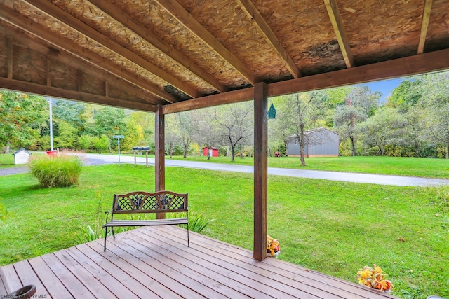 wooden deck featuring a yard