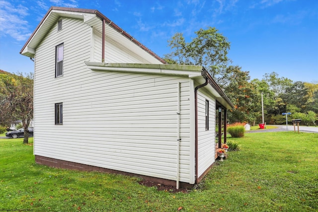 view of home's exterior featuring a yard