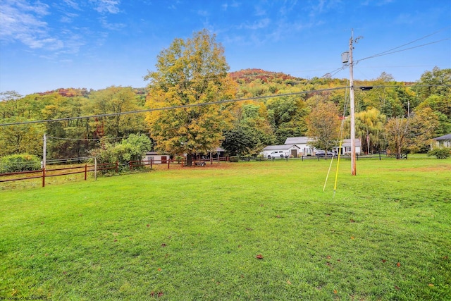 view of yard with a rural view