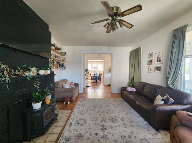 living room with ceiling fan and light hardwood / wood-style flooring