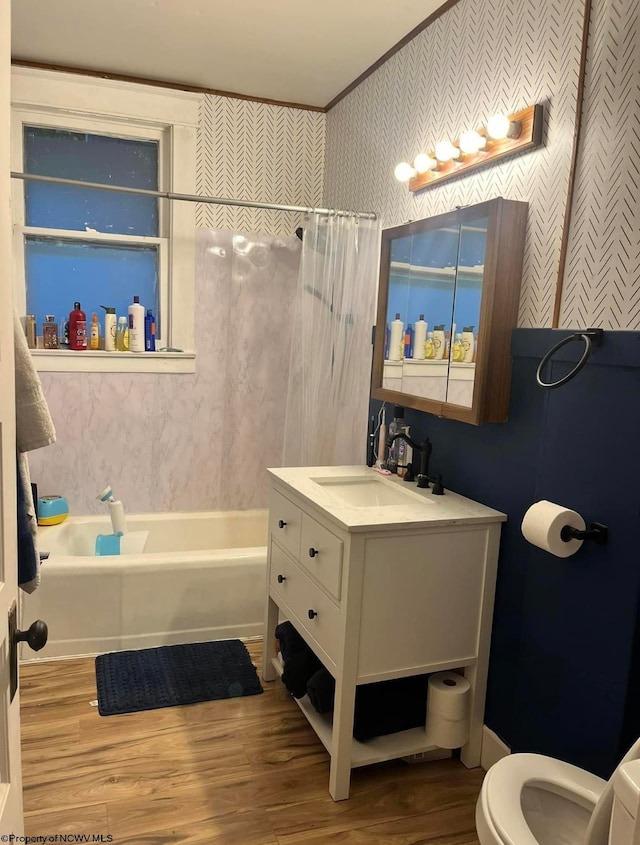 full bathroom featuring shower / bathtub combination with curtain, hardwood / wood-style flooring, vanity, and toilet