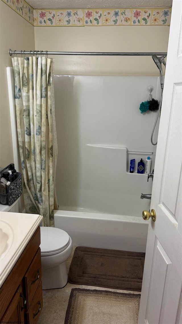 full bathroom with shower / tub combo, vanity, and toilet