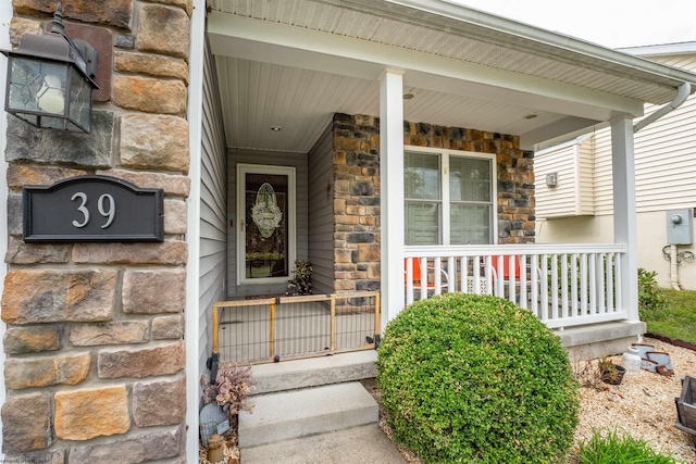 view of exterior entry featuring a porch