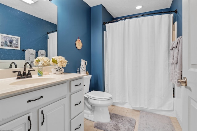 bathroom with tile patterned floors, a shower with curtain, vanity, and toilet