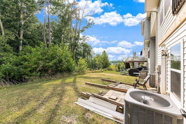 view of yard featuring central air condition unit