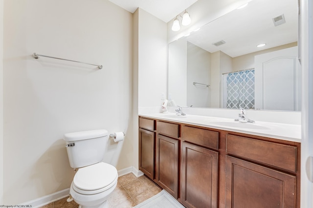 bathroom featuring walk in shower, tile patterned flooring, vanity, and toilet