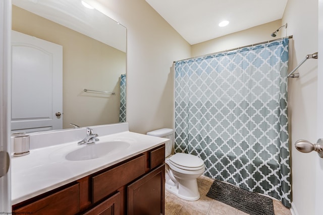 bathroom featuring tile patterned flooring, vanity, toilet, and a shower with curtain