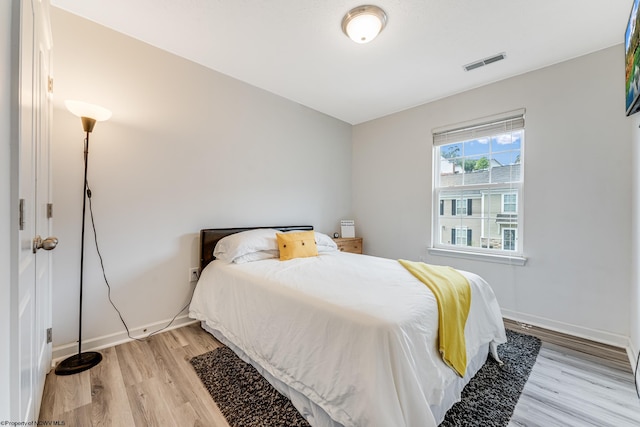 bedroom with light wood-type flooring