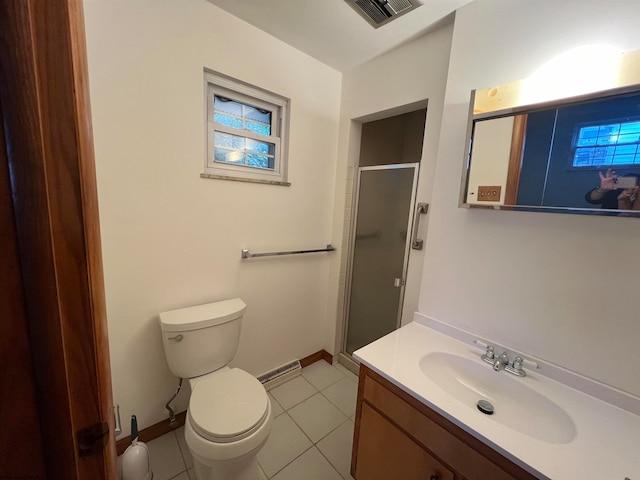 bathroom with vanity, a shower with shower door, toilet, and tile patterned flooring