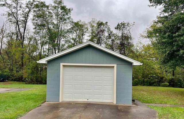 garage featuring a lawn