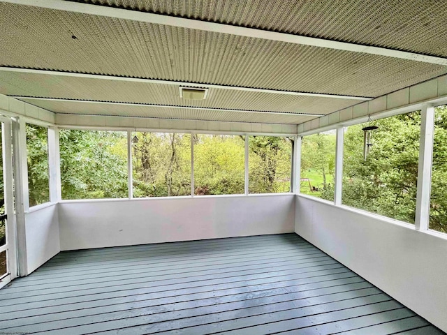 unfurnished sunroom featuring a healthy amount of sunlight