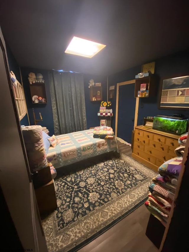 bedroom with wood-type flooring