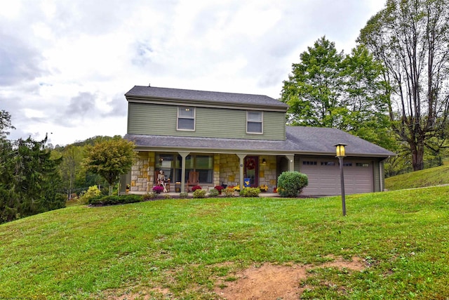 view of front of house with a garage, a porch, and a front lawn