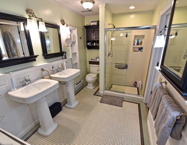 bathroom with ornamental molding, tile patterned flooring, an enclosed shower, and toilet