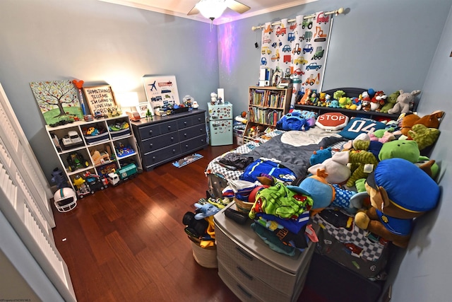 bedroom featuring ceiling fan, crown molding, and dark hardwood / wood-style flooring