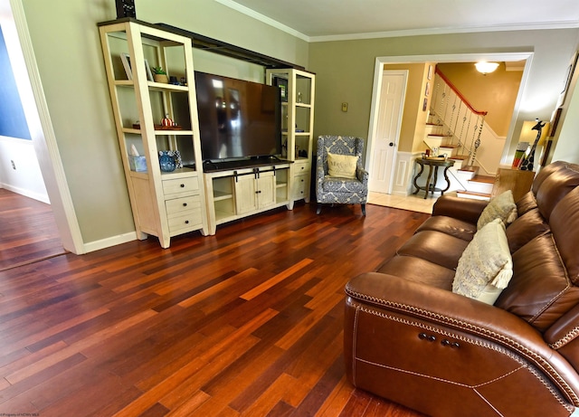 living room featuring dark hardwood / wood-style floors and crown molding