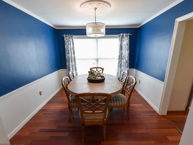 dining area featuring crown molding and dark hardwood / wood-style flooring