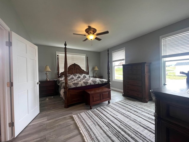 bedroom featuring ceiling fan and hardwood / wood-style flooring