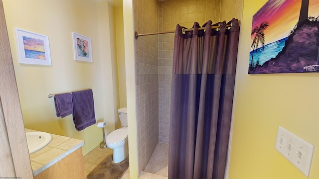 bathroom with tile patterned floors, curtained shower, and toilet