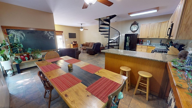 dining room featuring ceiling fan